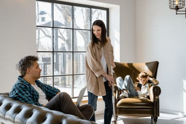 Happy family spending time together in a bright living room