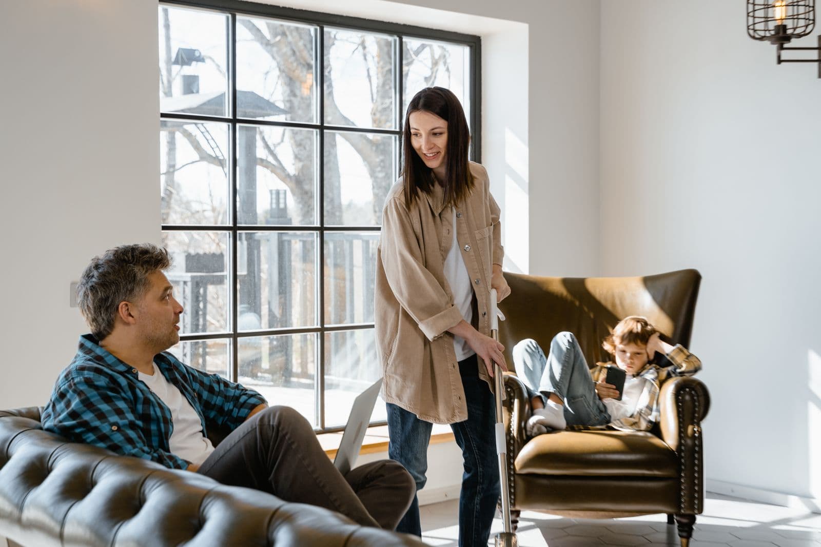 Happy family spending time together in a bright living room