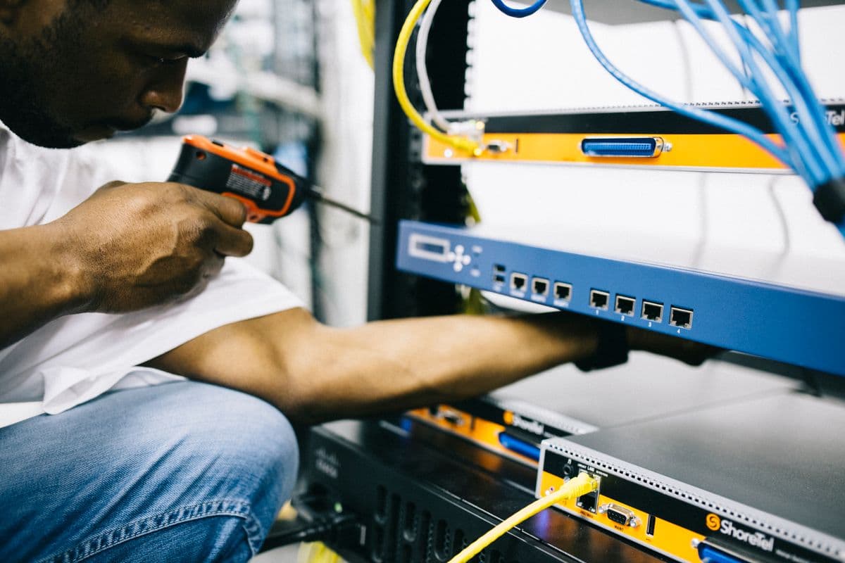 Technician working on HVAC hardware components